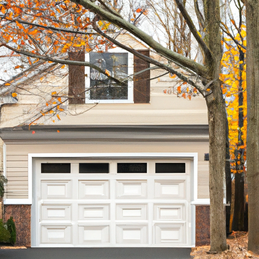 Suburban Summit house with a modern garage door visible on the driveway, trees and sidewalk in soft daylight.